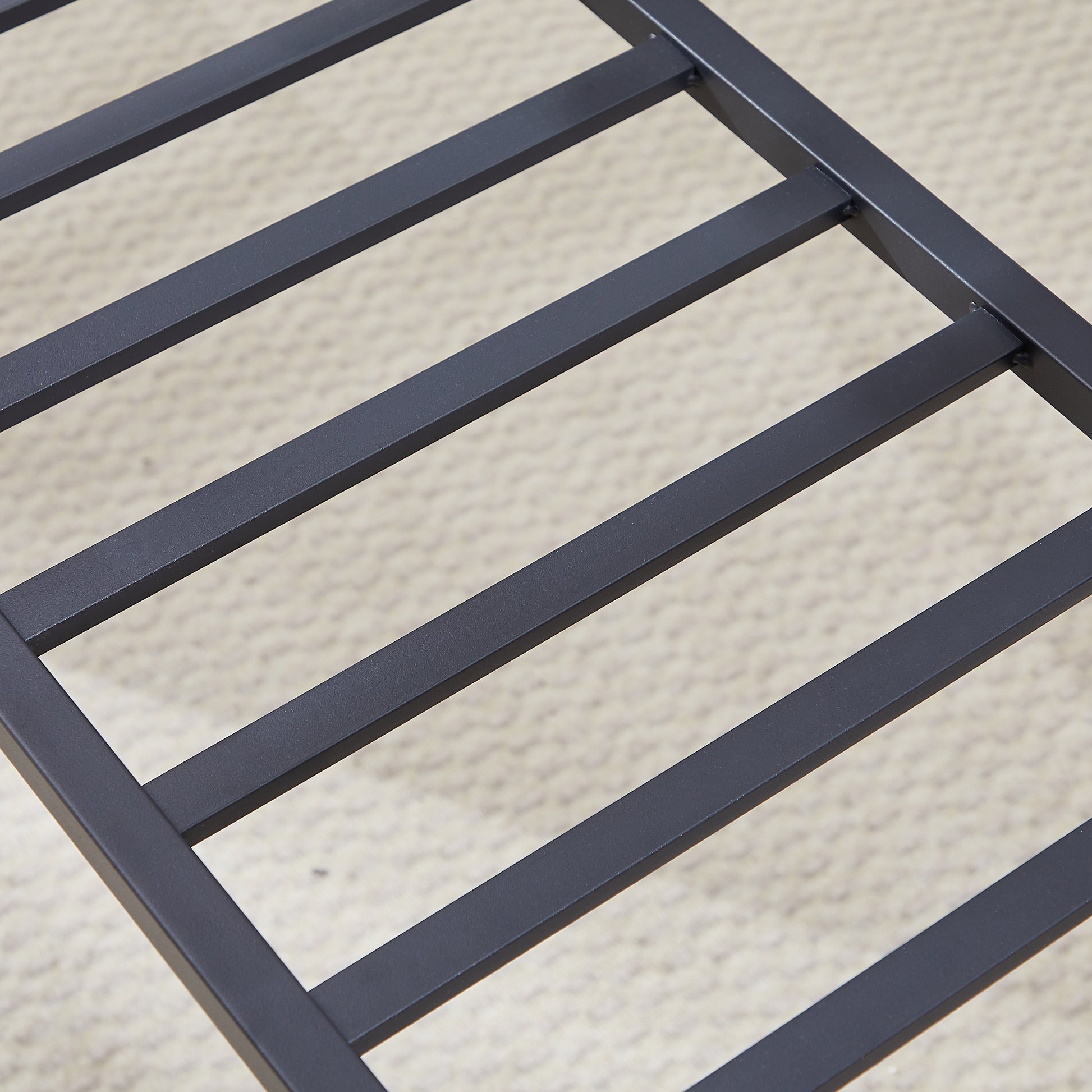 Black metal bed frame slats