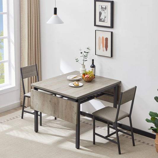 Compact dropleaf dining table with light oak finish and gray chairs