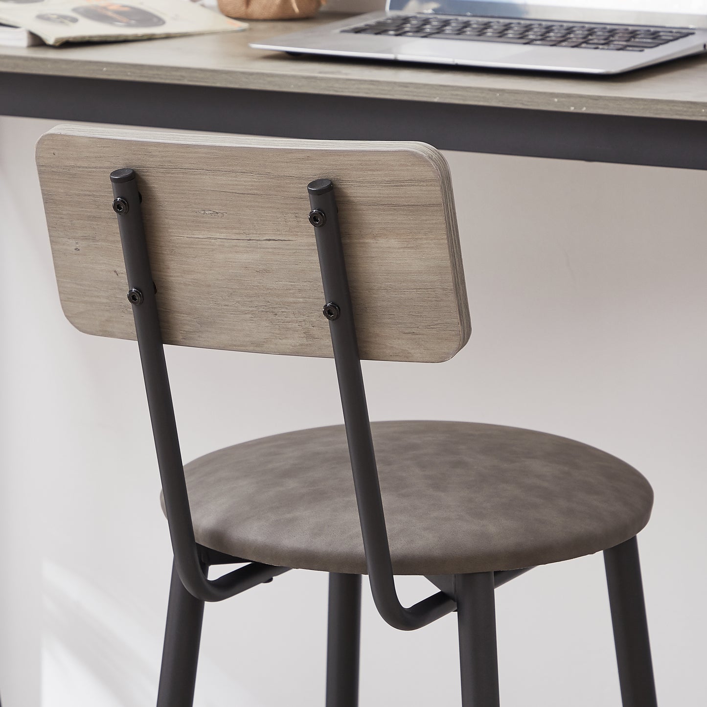 Gray faux leather bar stool with light wood back and black metal legs