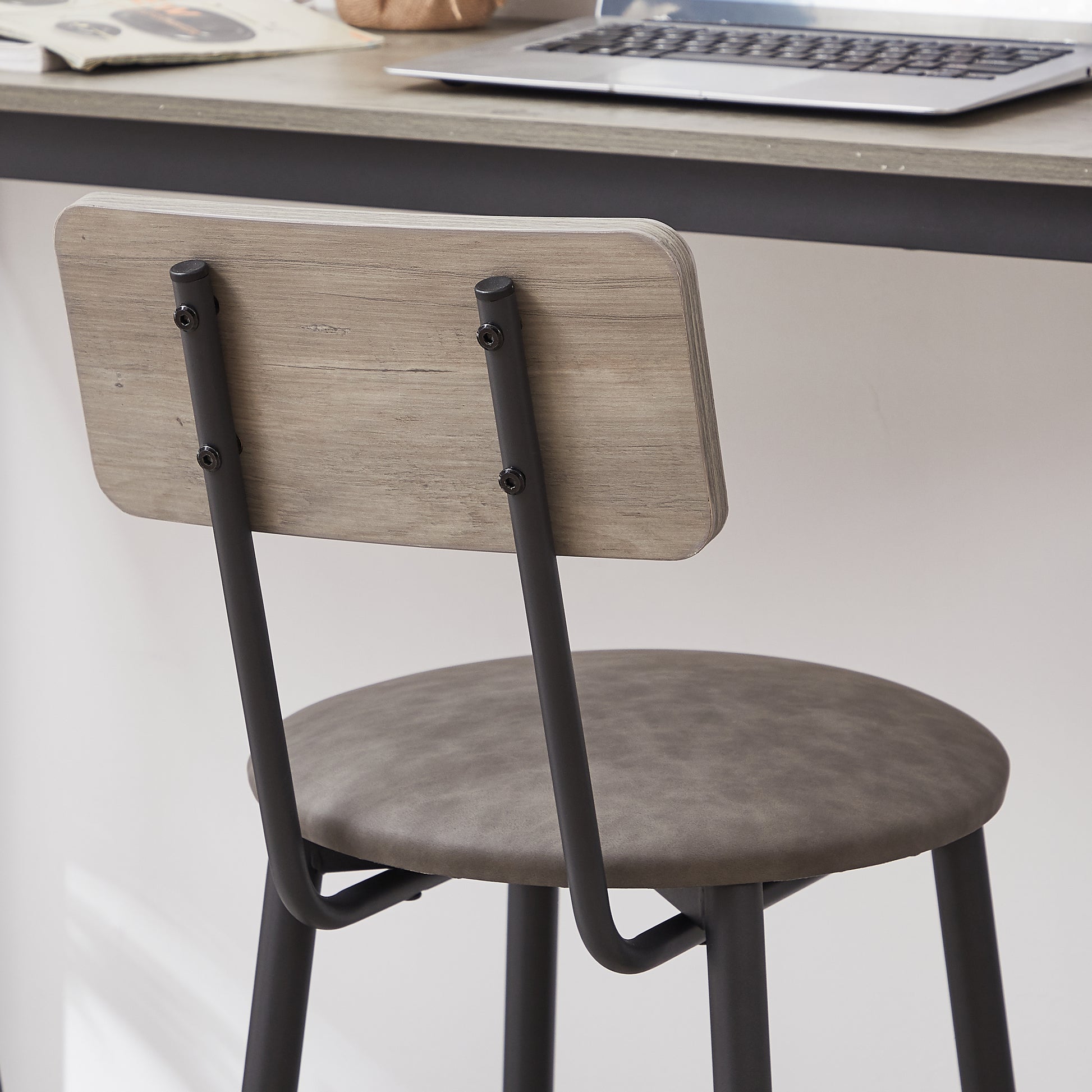 Gray faux leather bar stool with light wood back and black metal legs
