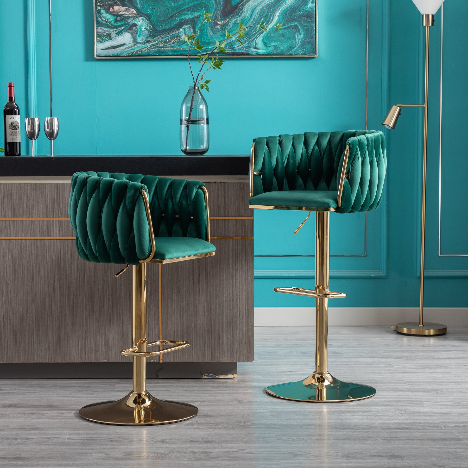 Emerald green velvet bar stool with tufted back and gold base