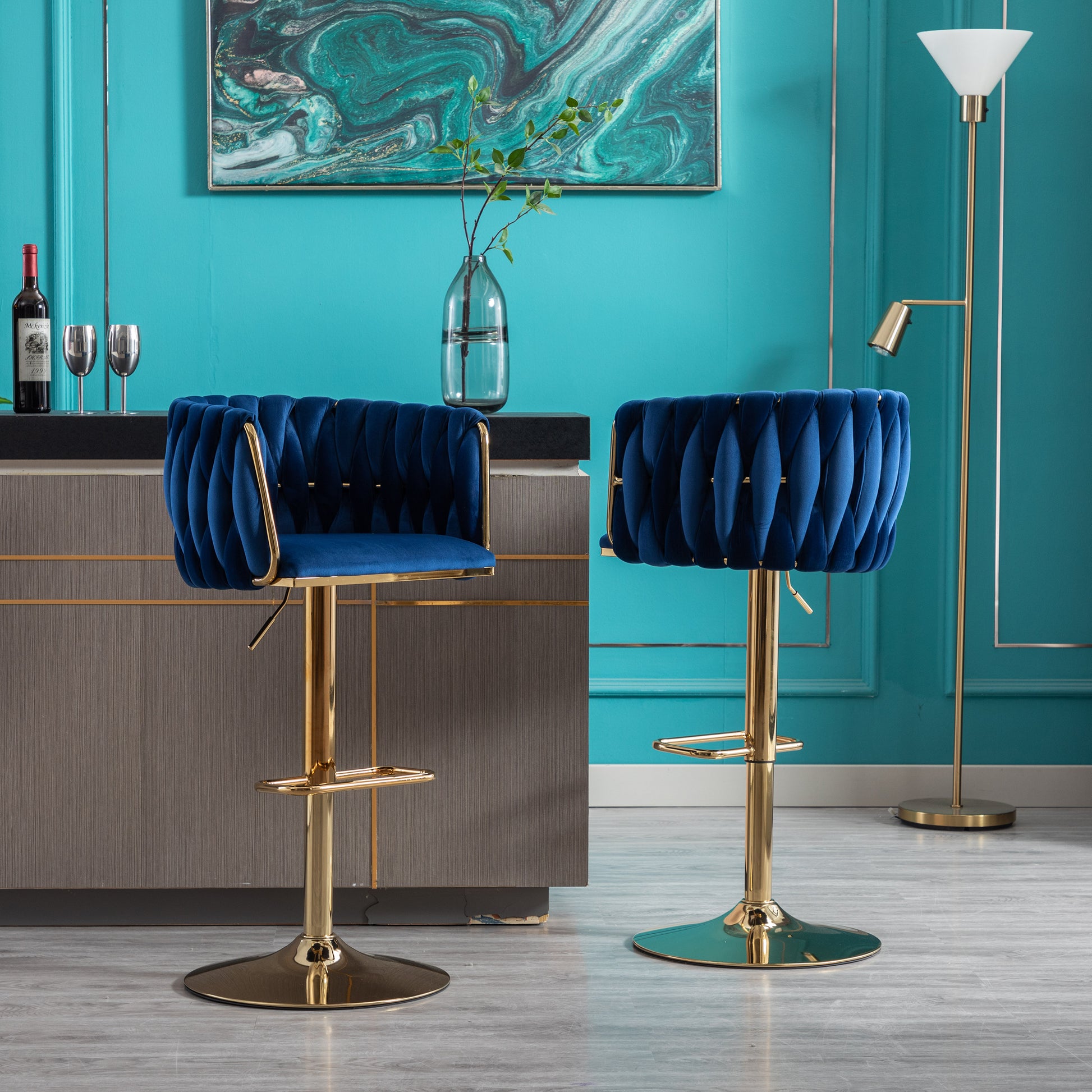 Deep blue velvet tufted bar stool with gold base and adjustable height