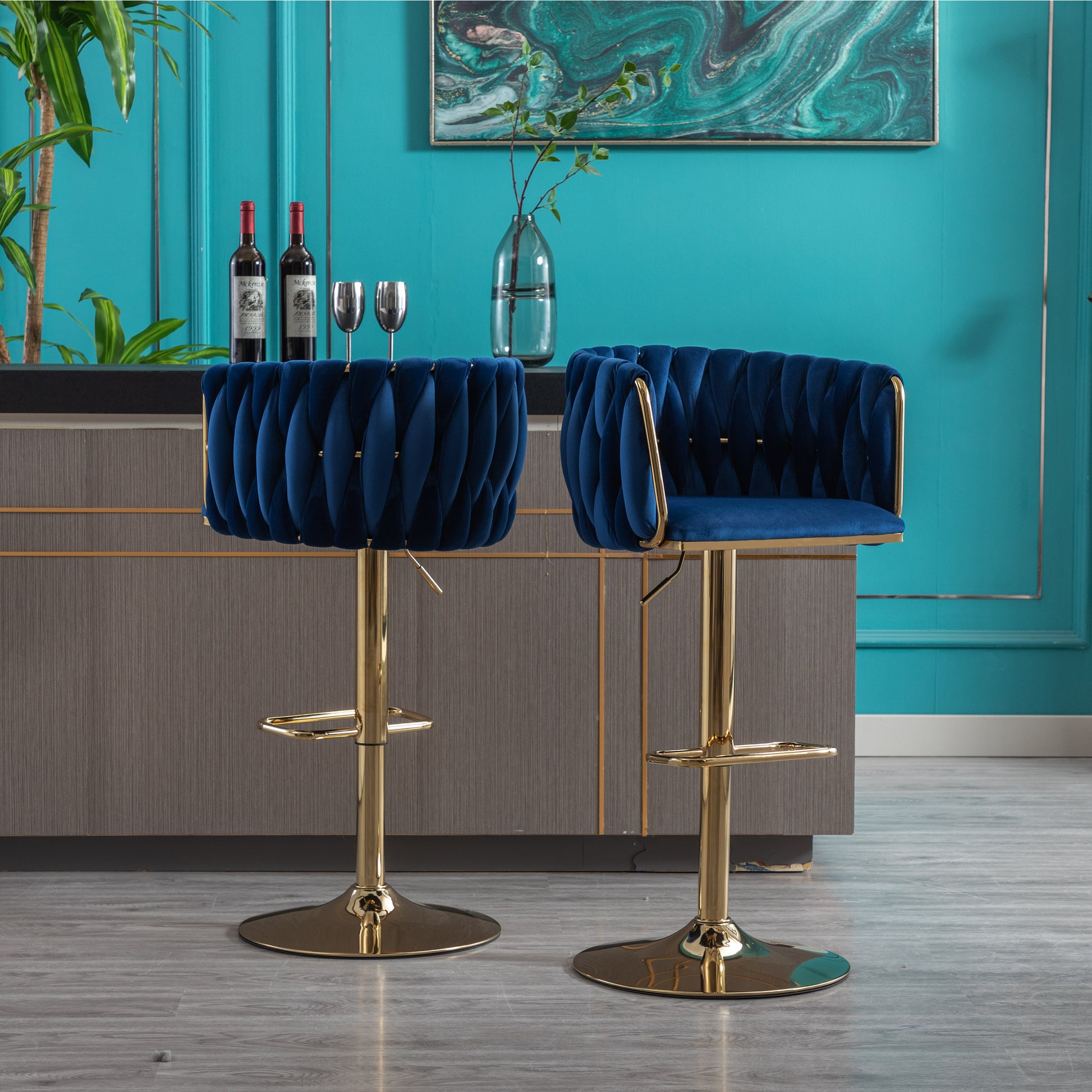 Navy blue velvet bar stool with gold accents and tufted detailing