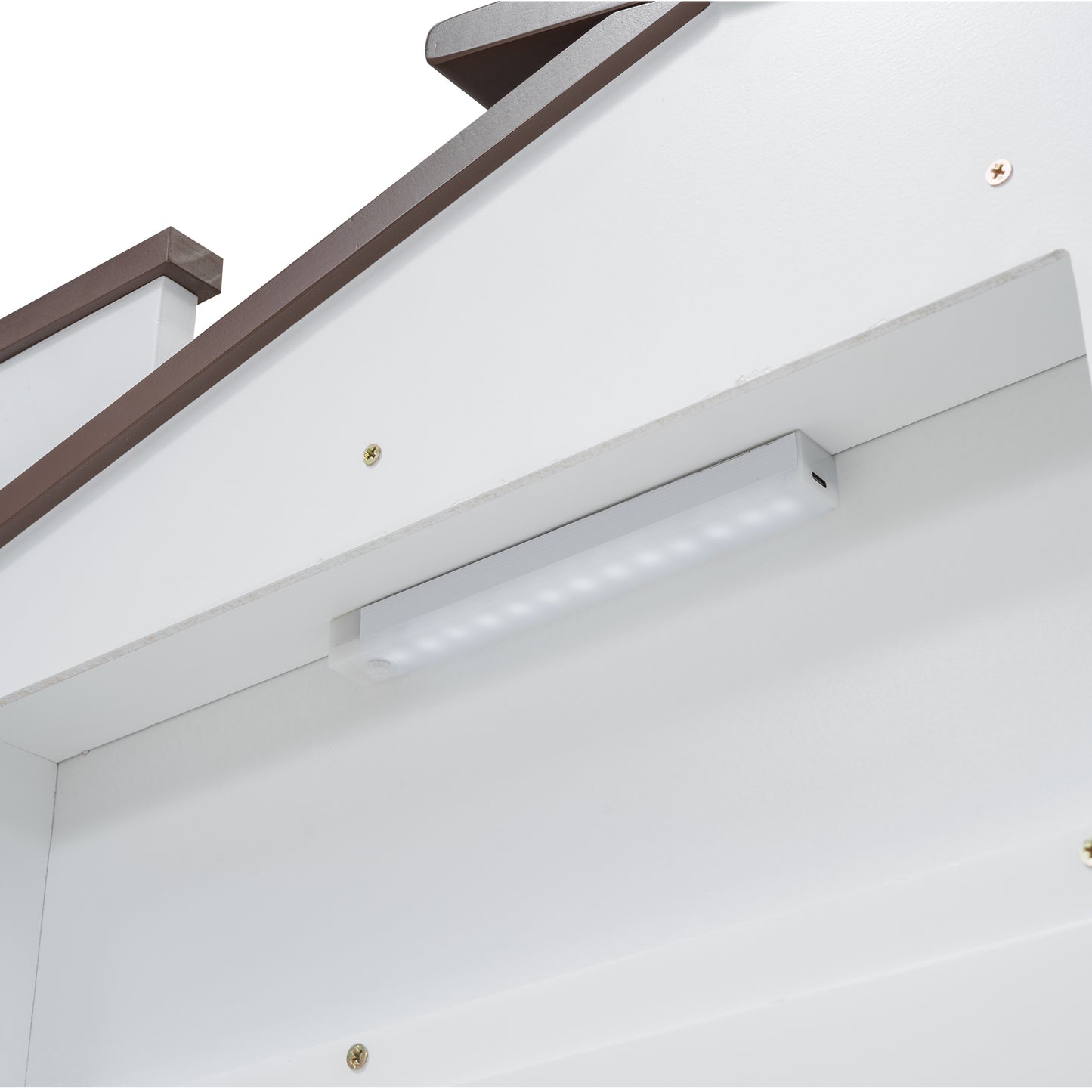 White LED light strip attached to a white cabinet