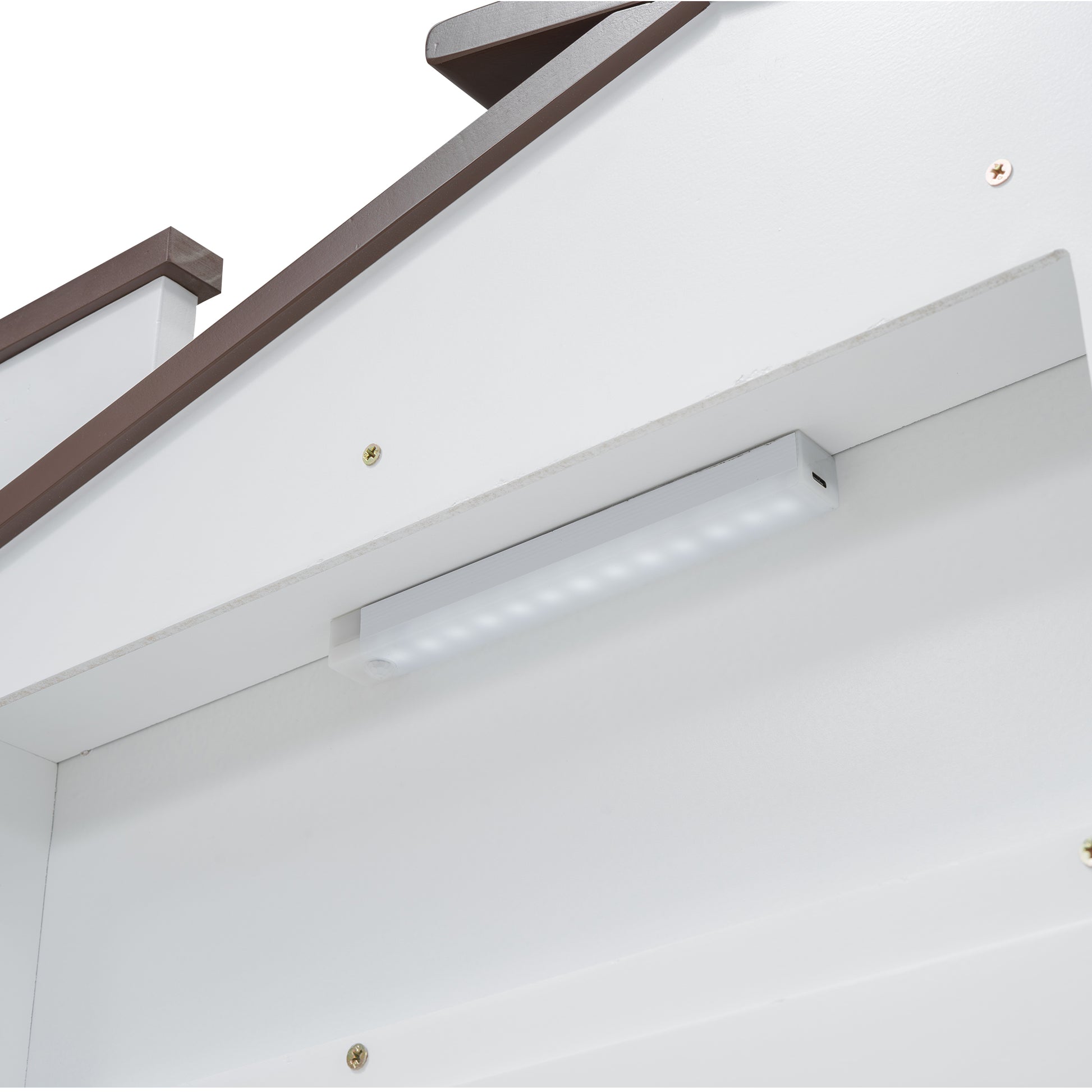 White LED light strip attached to a white cabinet
