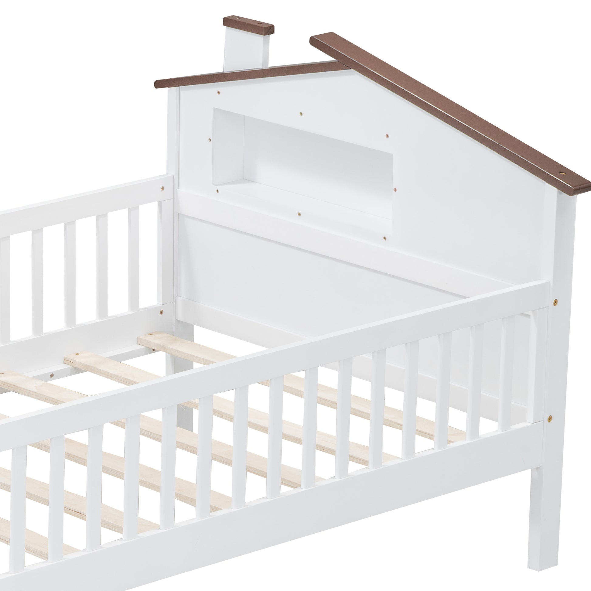 White wooden toddler bed with a houseshaped headboard and brown trim