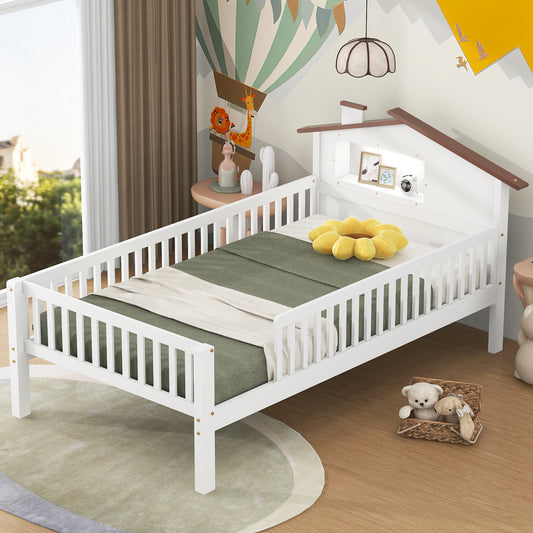 White wooden toddler bed with playful houseshaped headboard and storage cubby