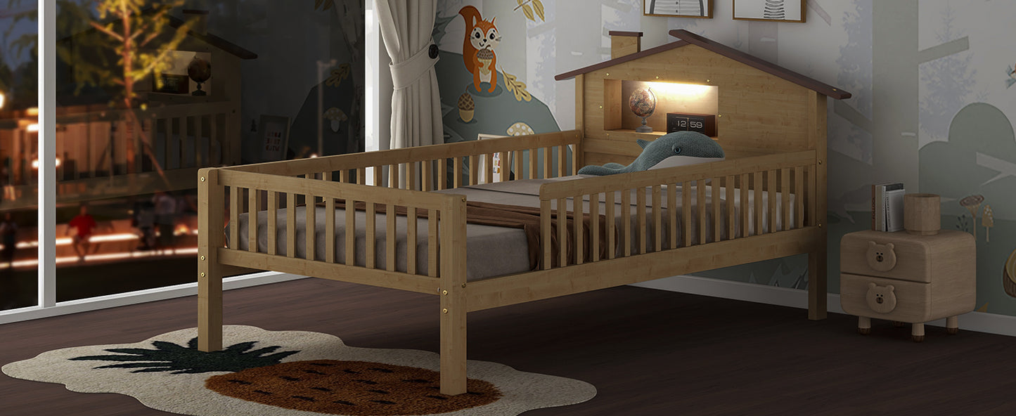 Natural wood toddler bed with houseshaped headboard and whale toy