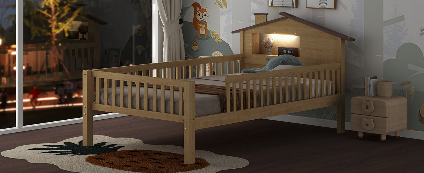 Natural wood toddler bed with houseshaped headboard and whale toy