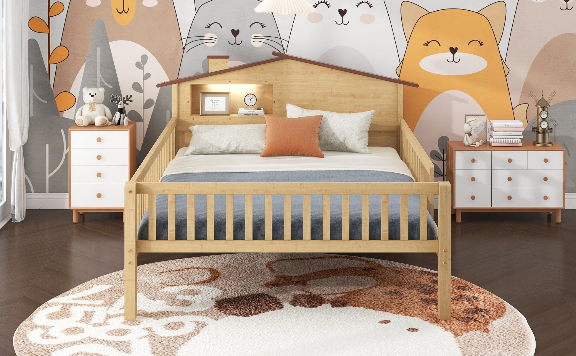 Natural wood toddler bed with houseshaped headboard and playful animal mural