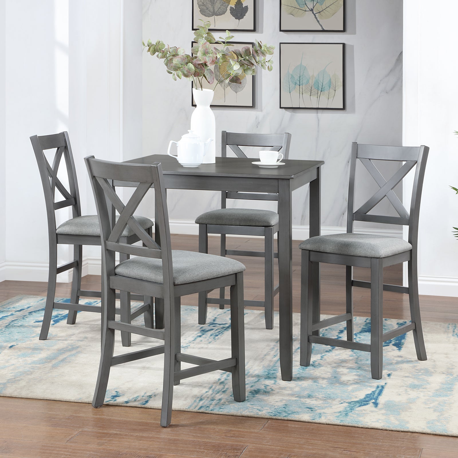 Gray wooden counter height dining set with four upholstered chairs