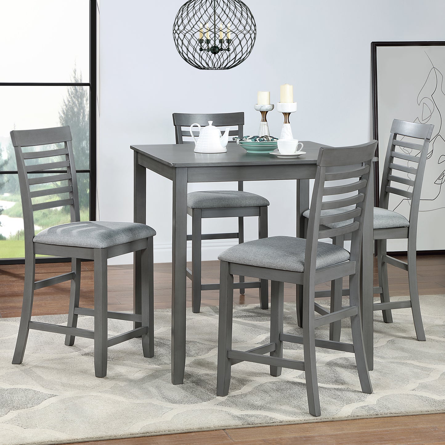 Gray counter height table with four slatted back stools