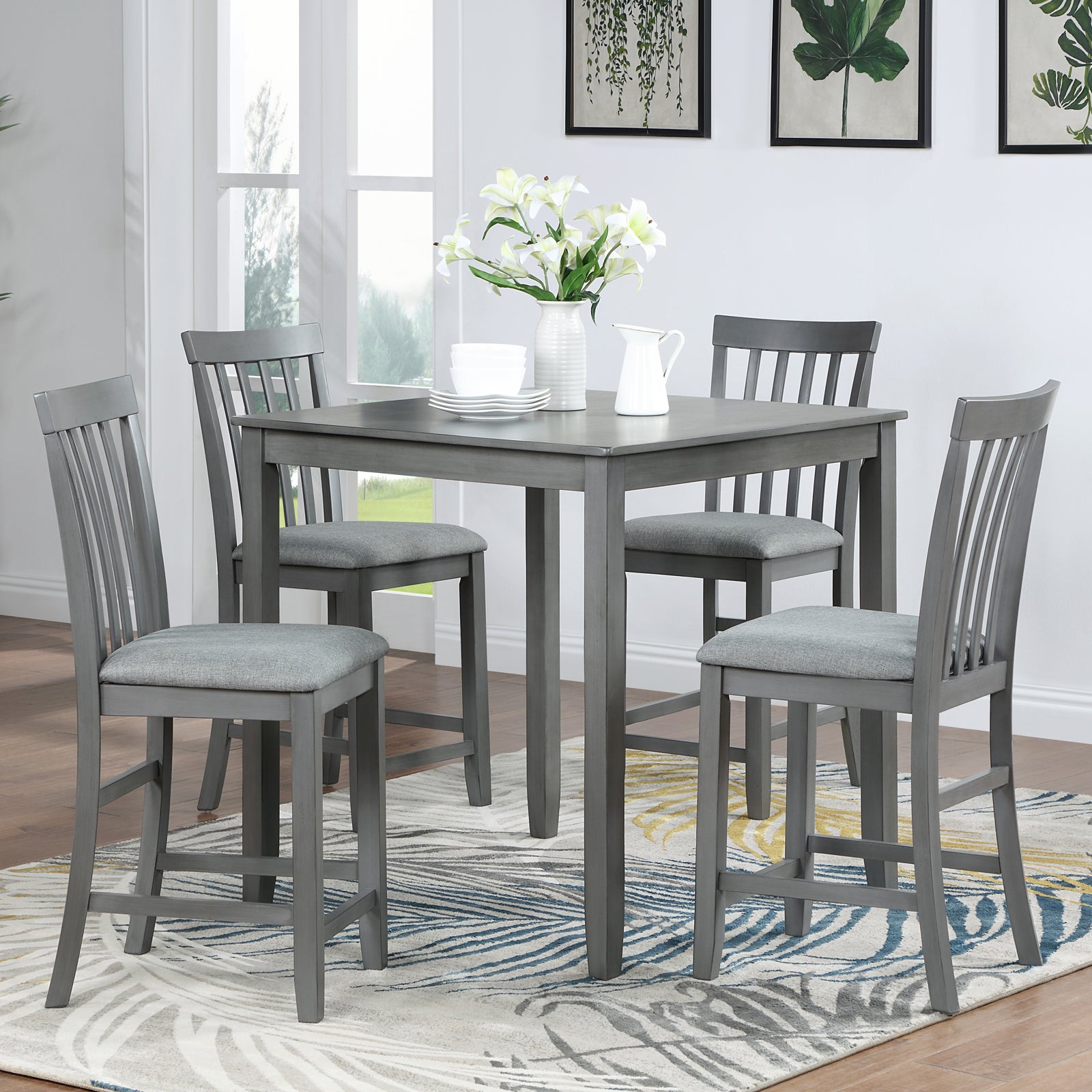 Gray counter height dining set with four padded stools