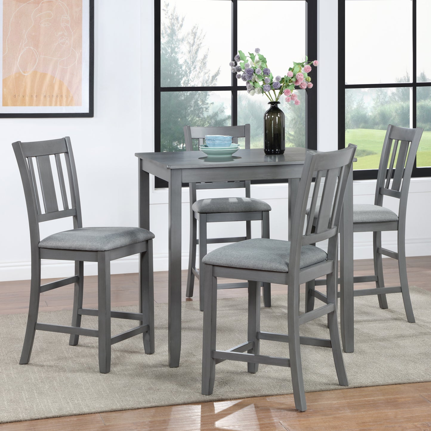 Gray wooden counter height table with four upholstered chairs