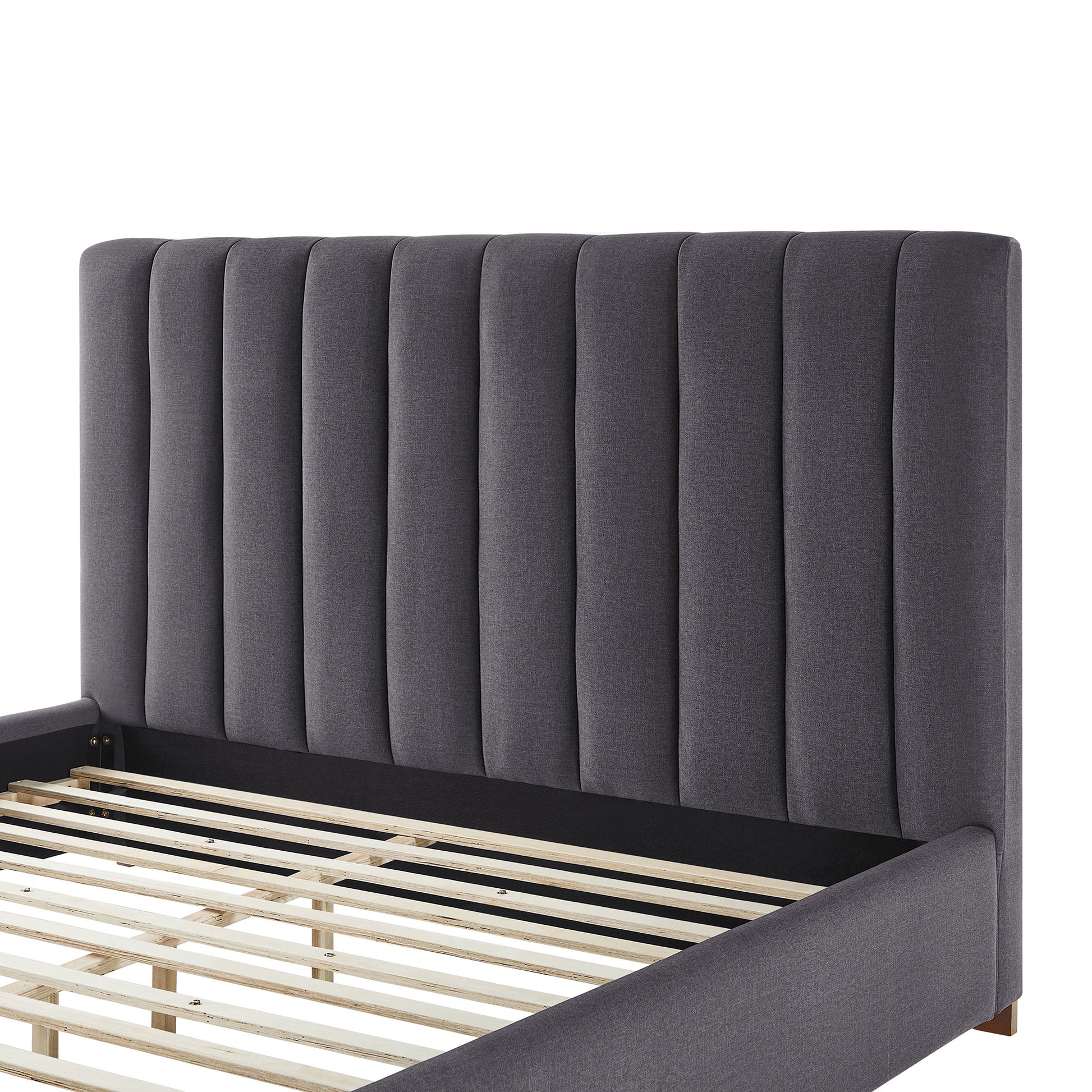 Dark gray fabric upholstered platform bed frame with vertical channel tufting on headboard