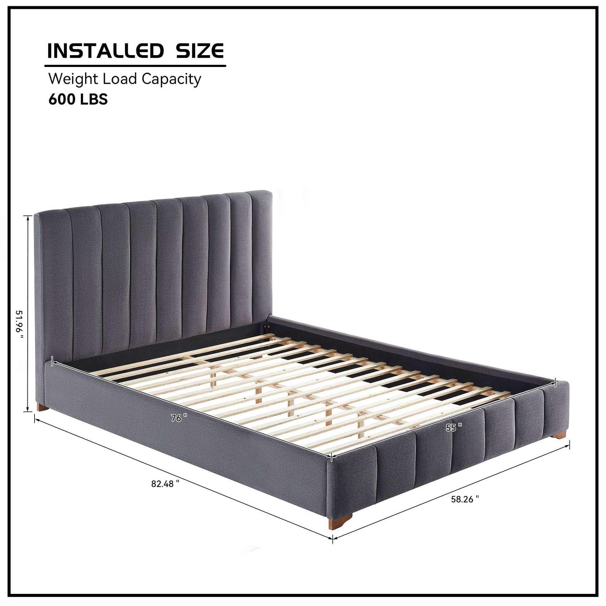 Platform bed with upholstered grey fabric and vertical channel tufting on headboard