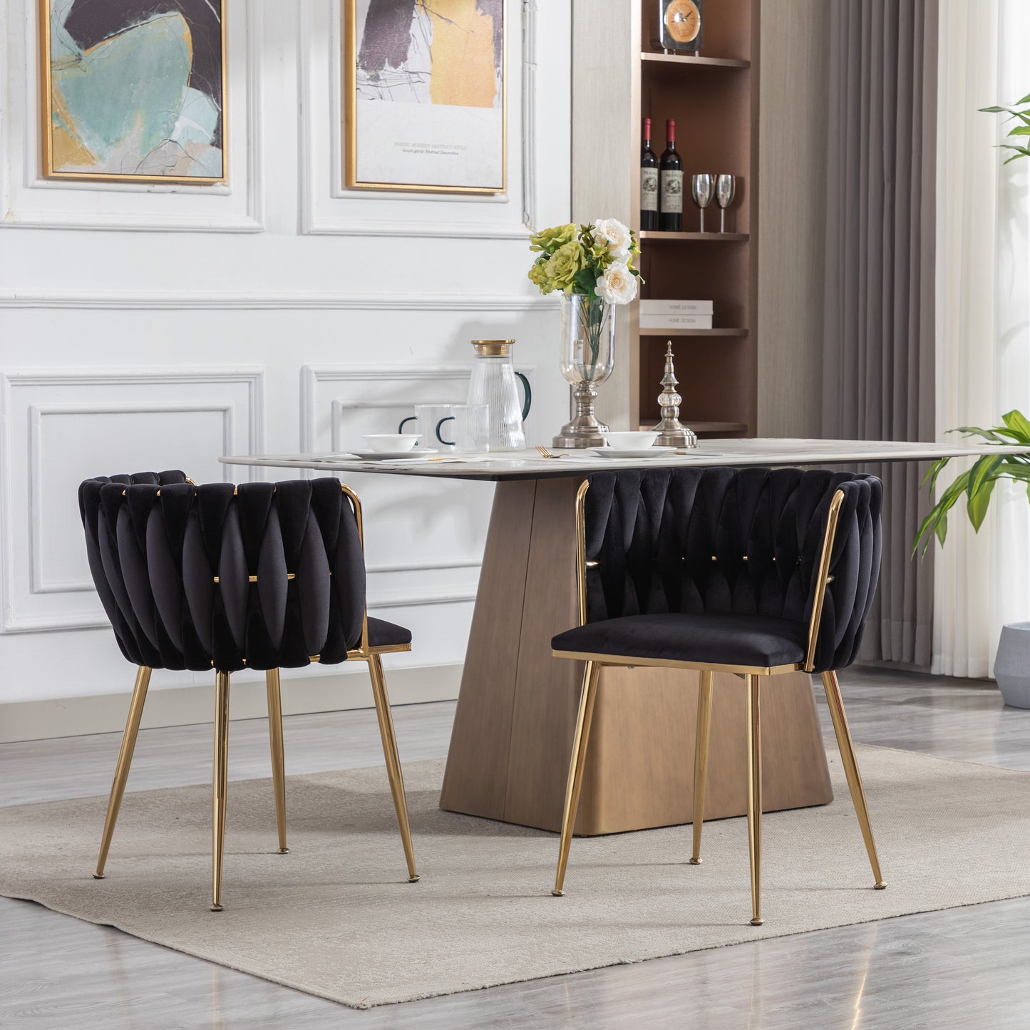 Black velvet dining chair with tufted back and gold legs