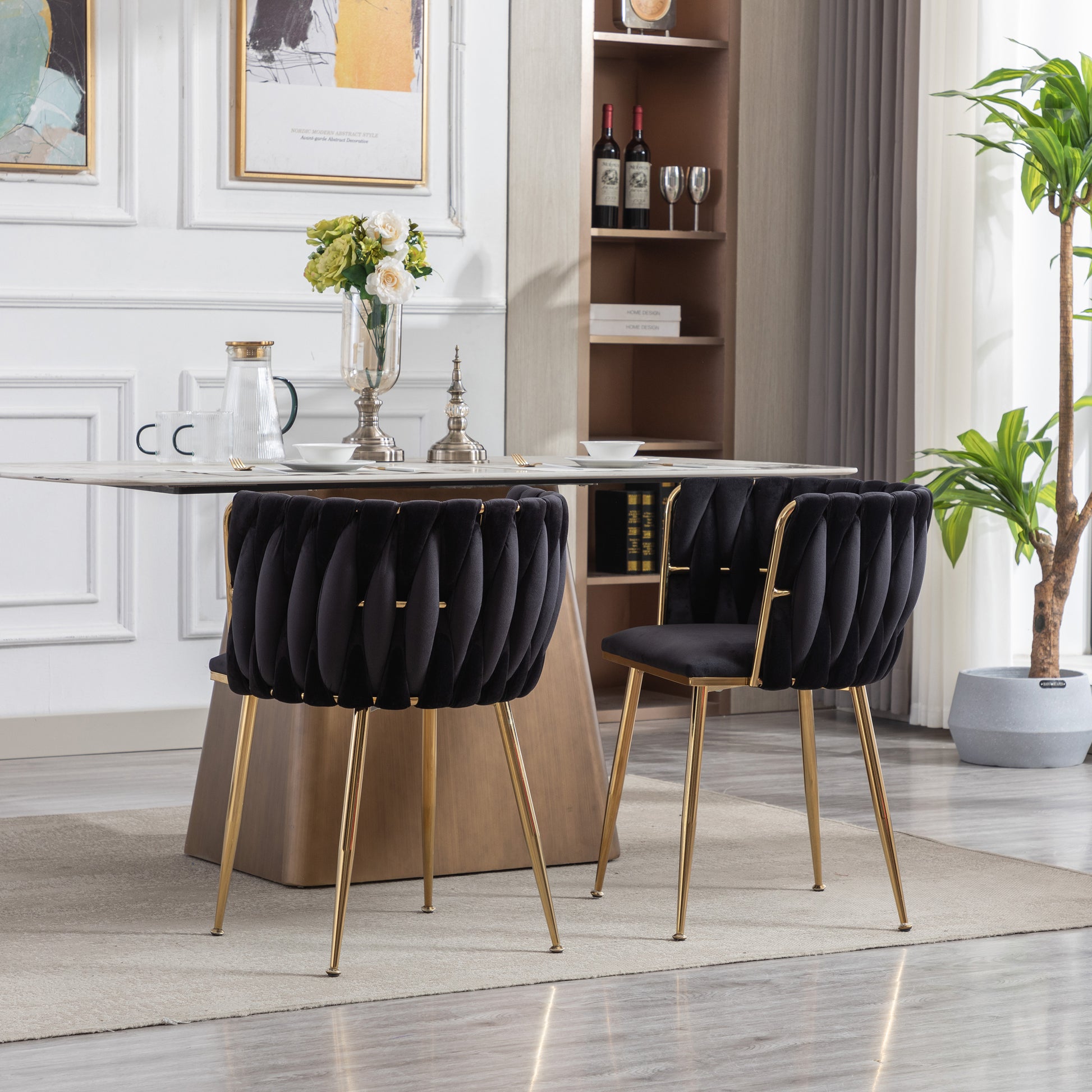 Black velvet accent chair with pleated design and gold legs