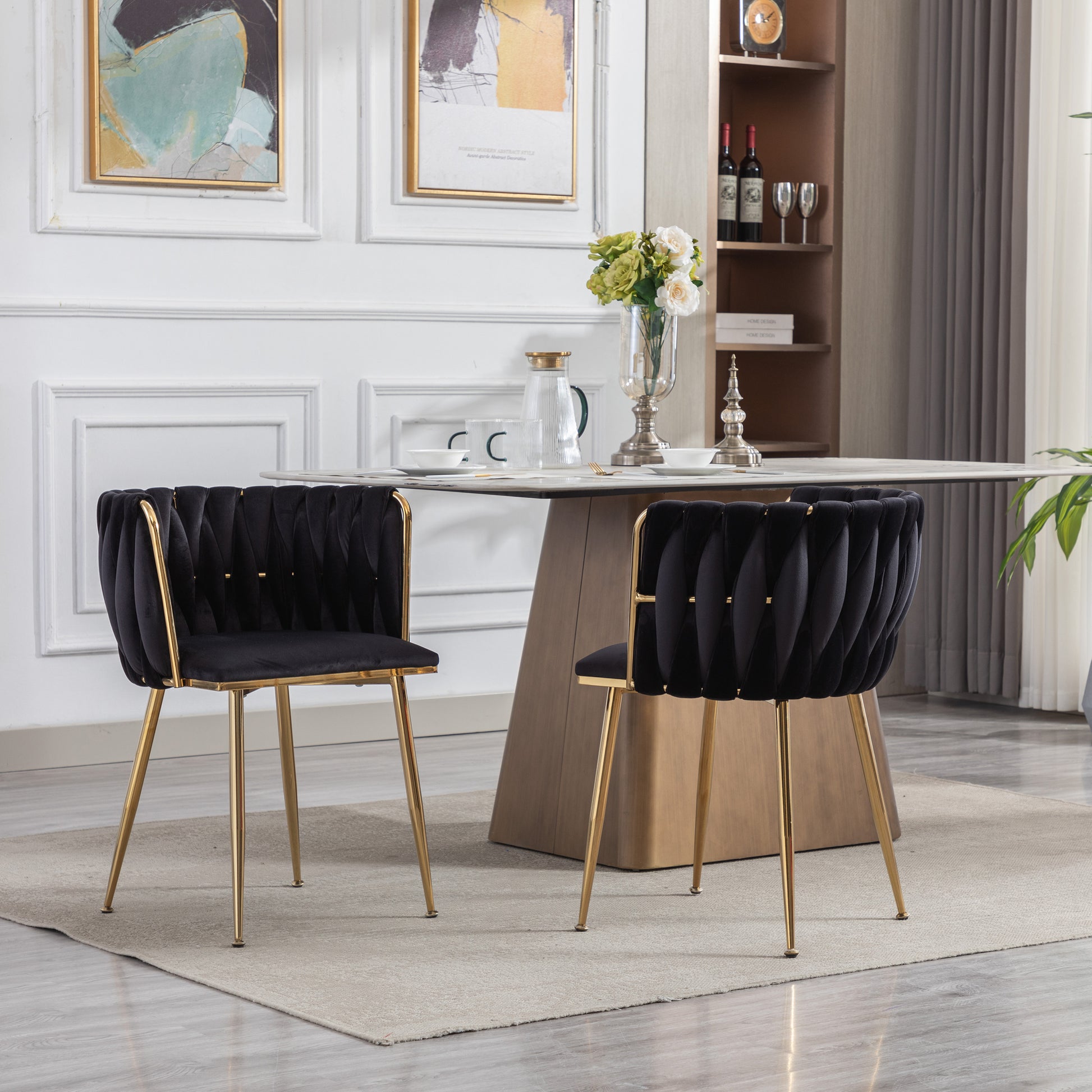 Black velvet accent chair with gold metal legs and pleated detailing