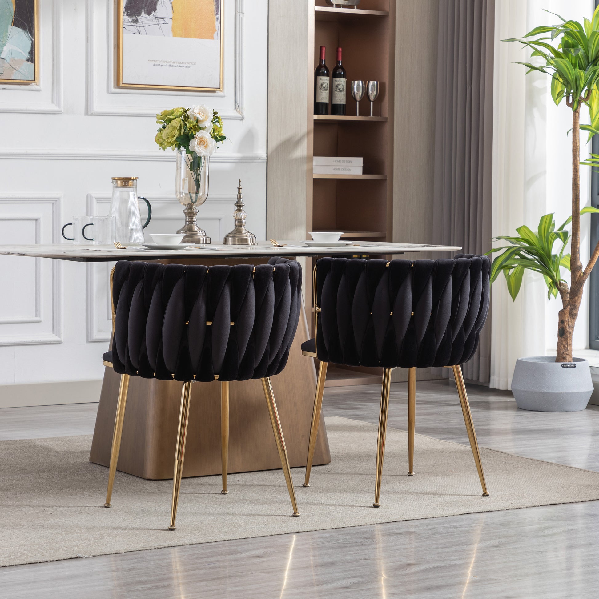 Black velvet accent chair with gold legs ideal for dining rooms or living areas