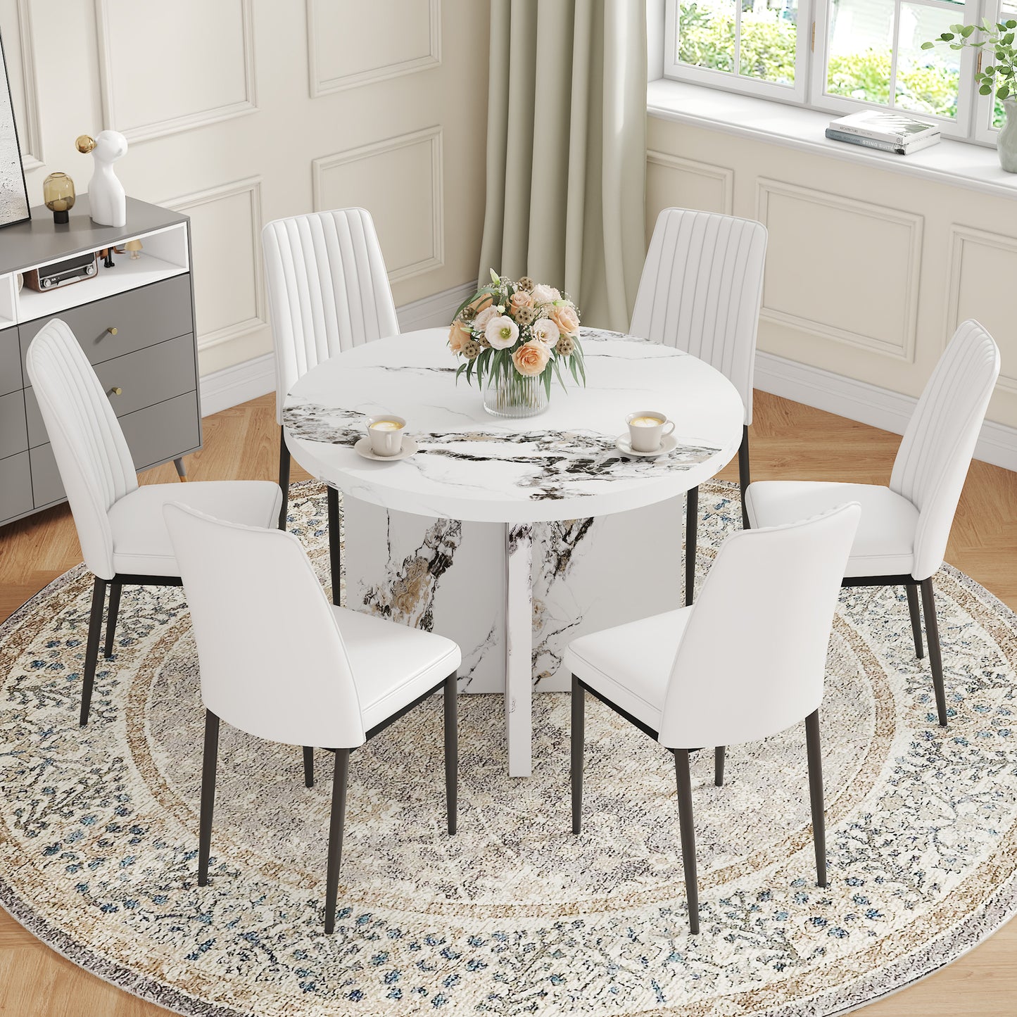 White upholstered dining chairs with black legs