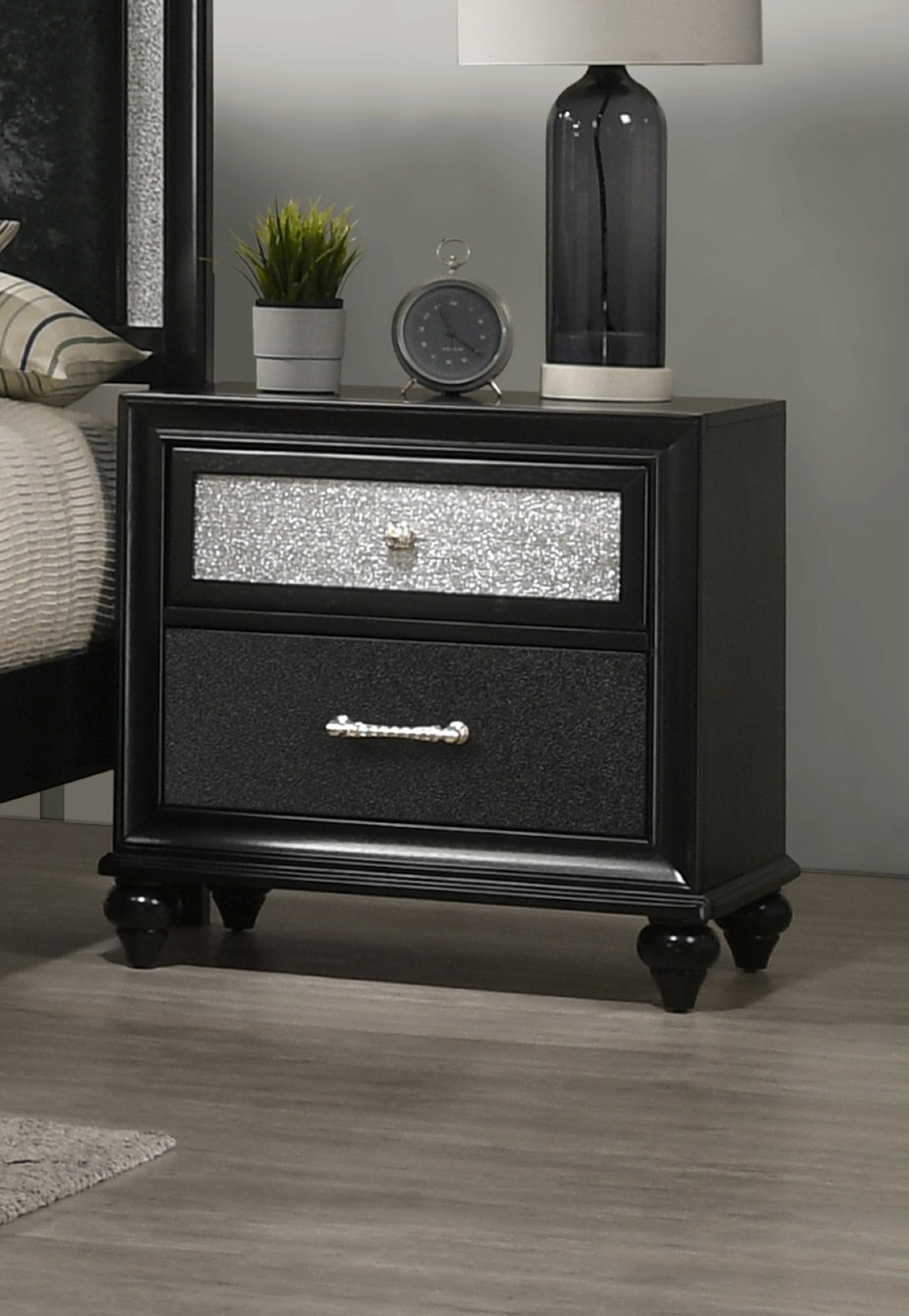 Black nightstand with two drawers featuring glitteraccented fronts