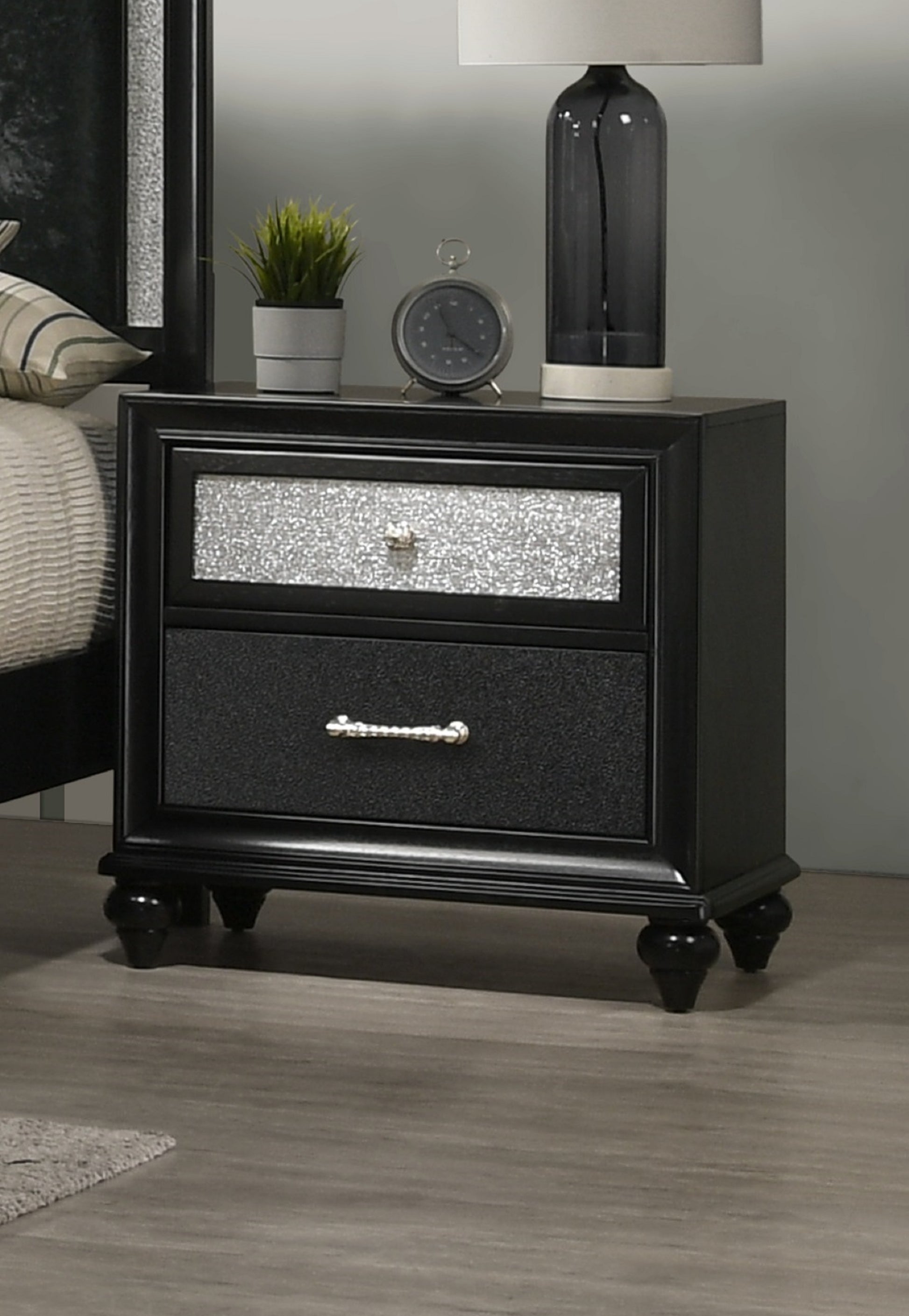 Black nightstand with two drawers featuring glitteraccented fronts