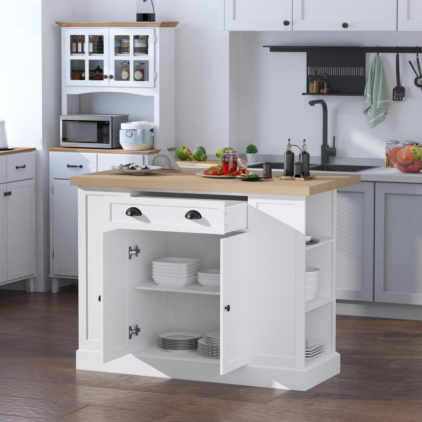 White kitchen island with open storage for dishes and drawer