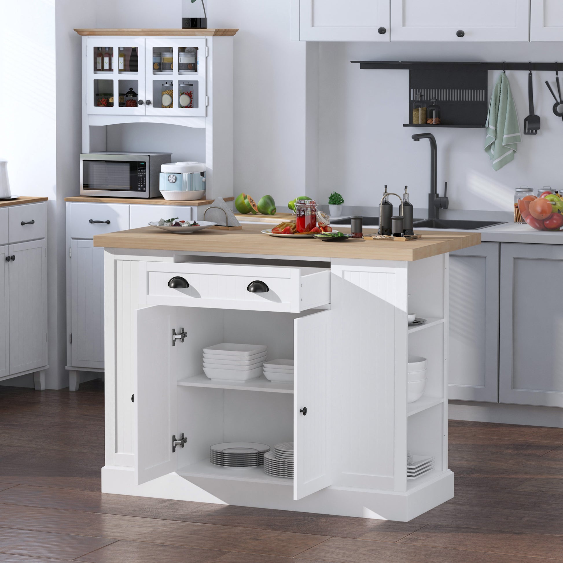 White kitchen island with open storage for dishes and drawer