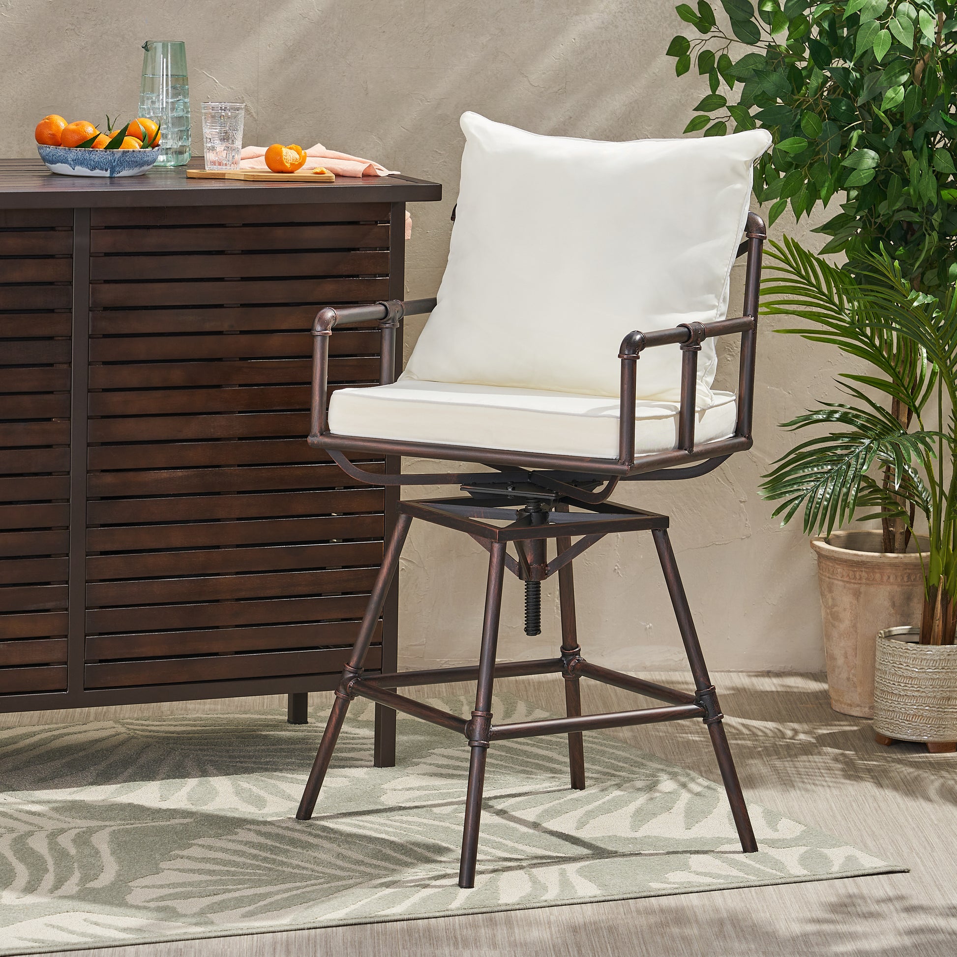 Antique bronze swivel bar stool with cream cushions industrial pipe design perfect for outdoor patios