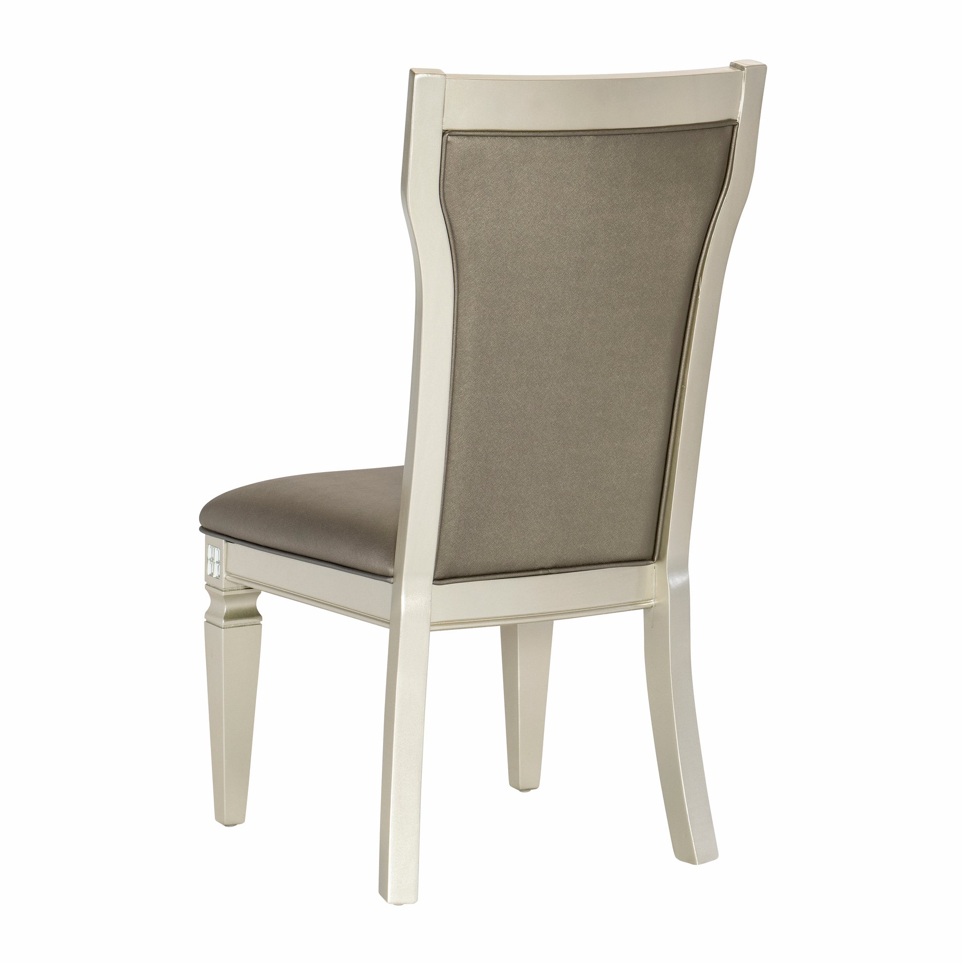 Champagne upholstered dining chair with carved legs