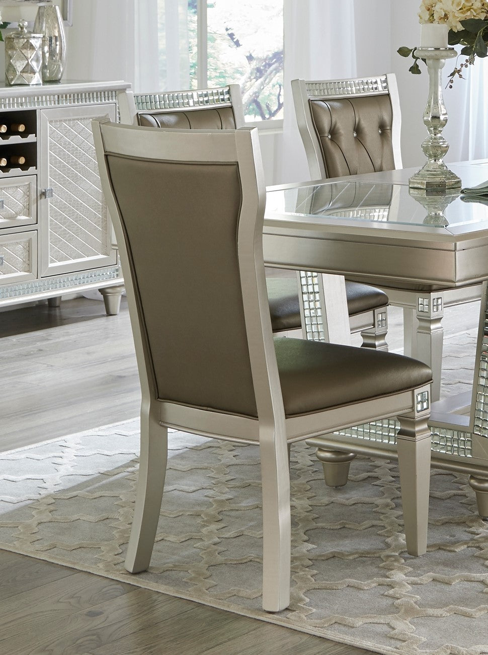 Taupe upholstered dining chair with silver wood frame and mirrored accents