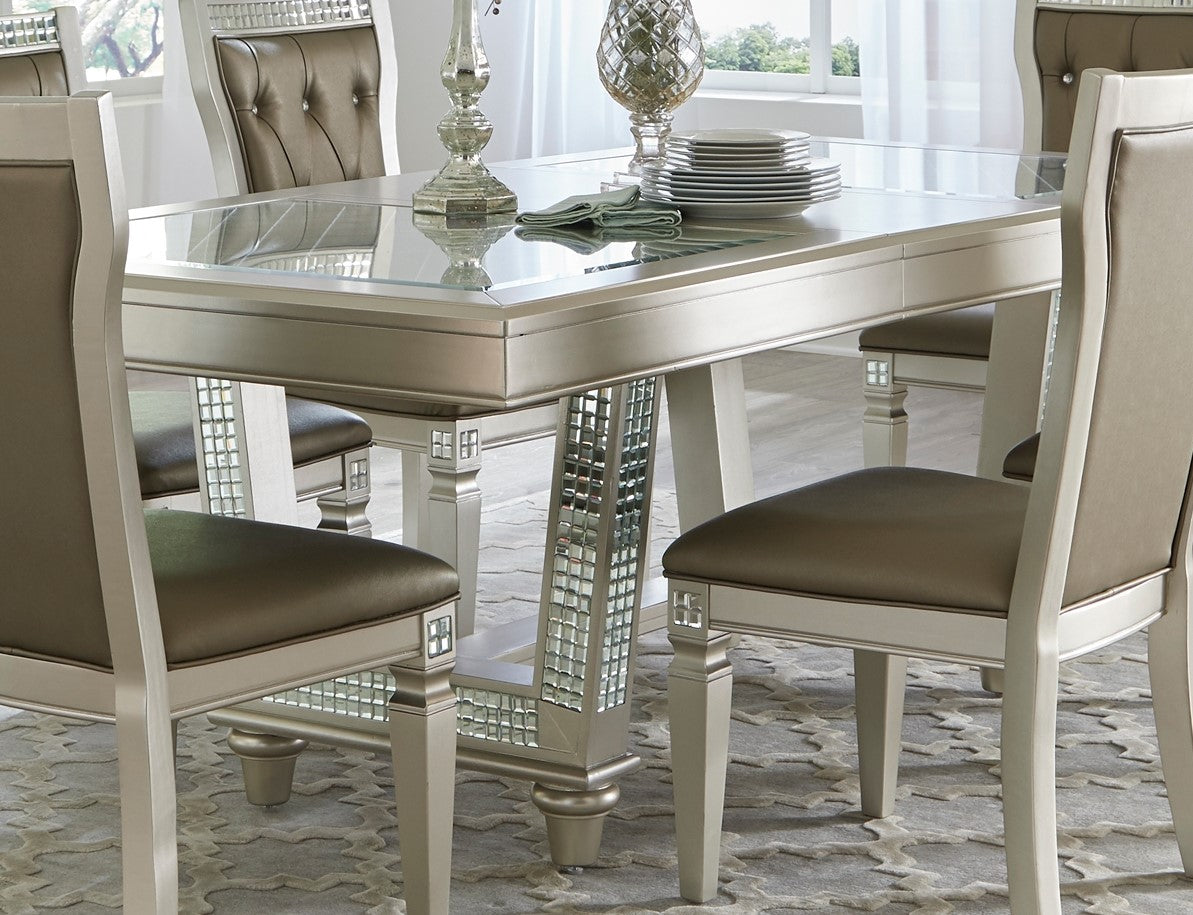 Glam dining table with mirrored accents and upholstered chairs