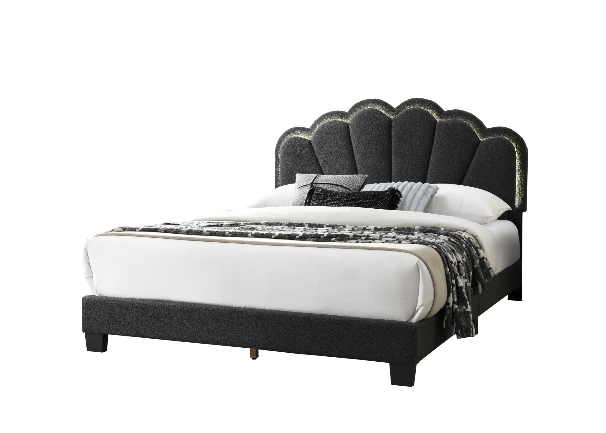 Dark grey upholstered platform bed with a scalloped headboard and gold trim
