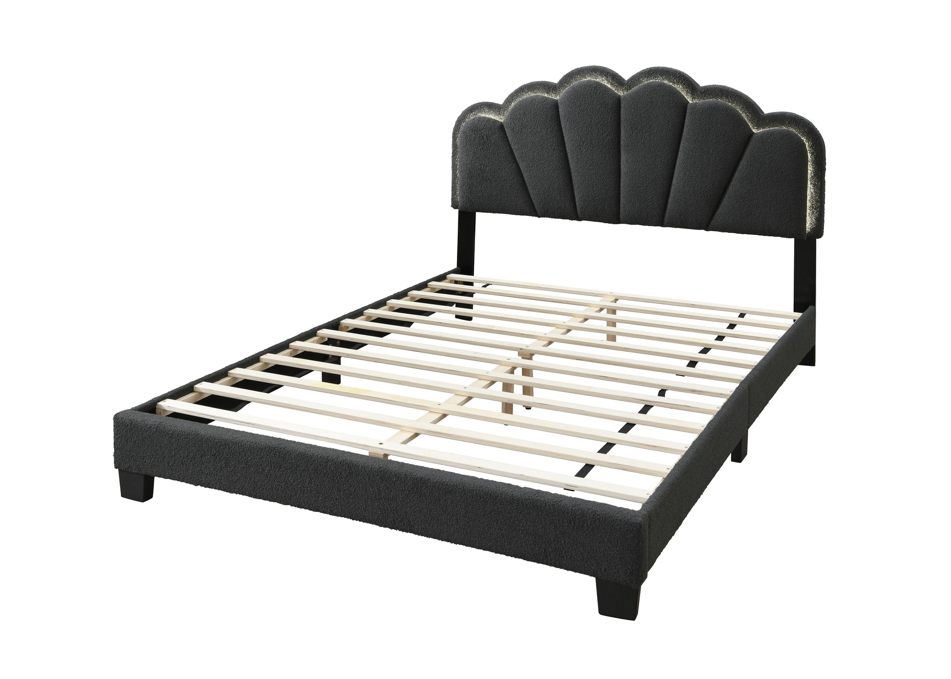 Dark grey upholstered bed frame with scalloped headboard