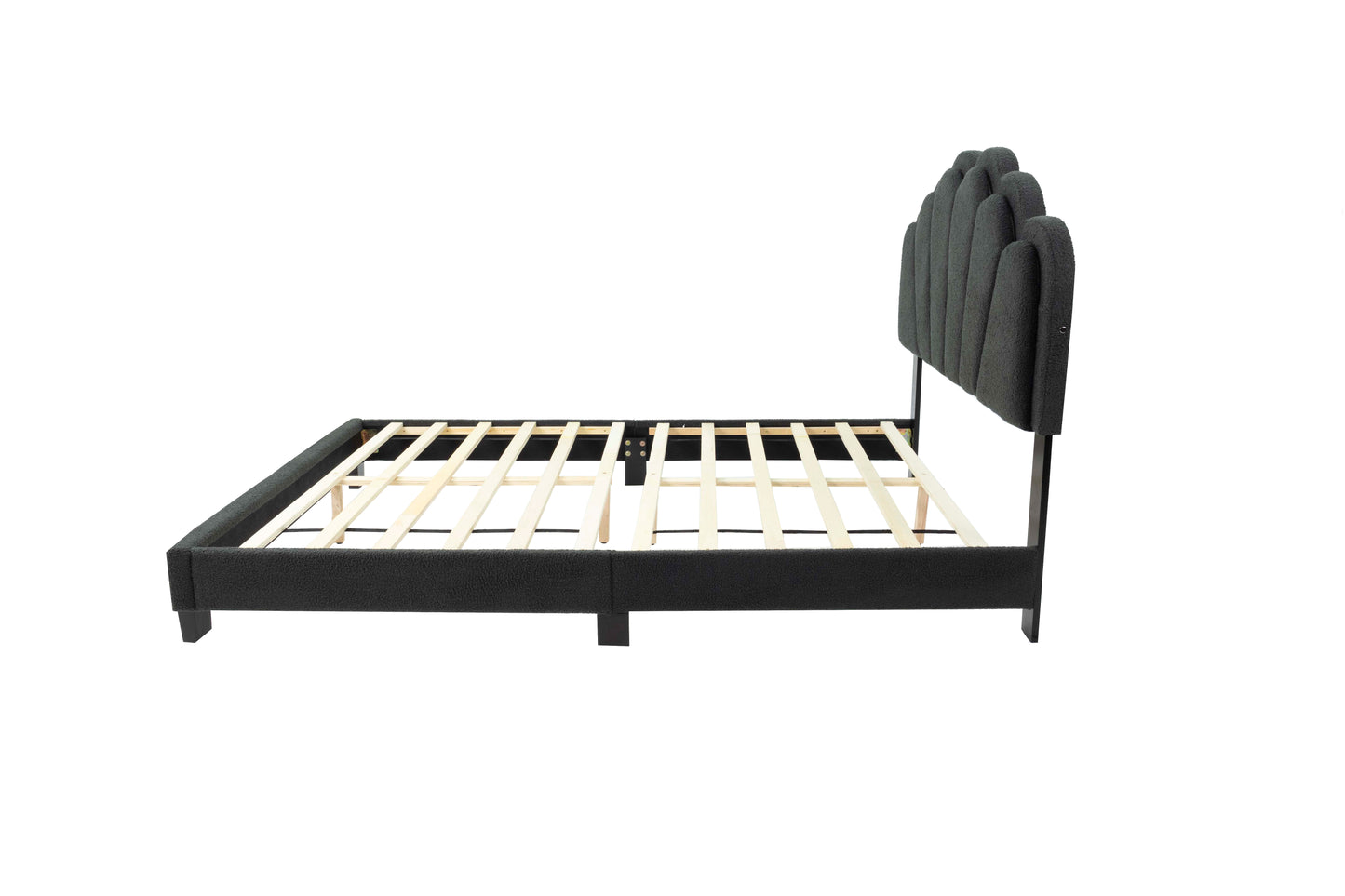 Dark gray fabric platform bed frame with a scalloped headboard and wooden slats