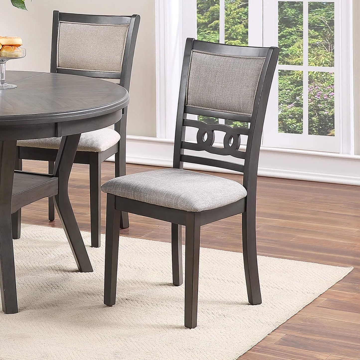 Dark grey wooden dining chair with light grey upholstered seat and back