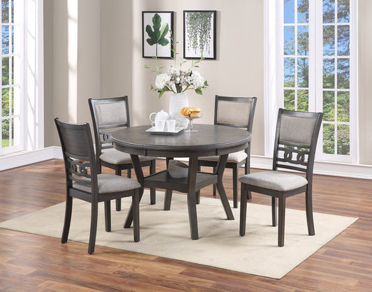 Round gray dining table with four upholstered chairs