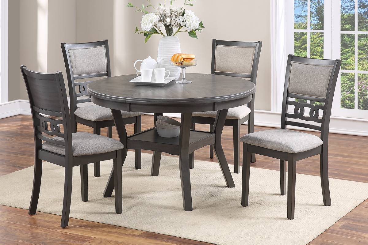 Gray round dining table with four upholstered chairs