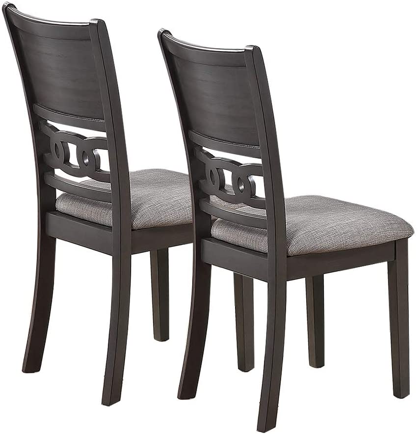 Two dark espresso wooden dining chairs with grey fabric seats and ornate circular back splats