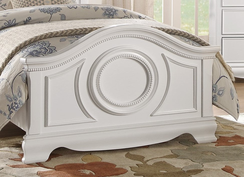 Ornate white wood bed frame with carved detailing and circular motif