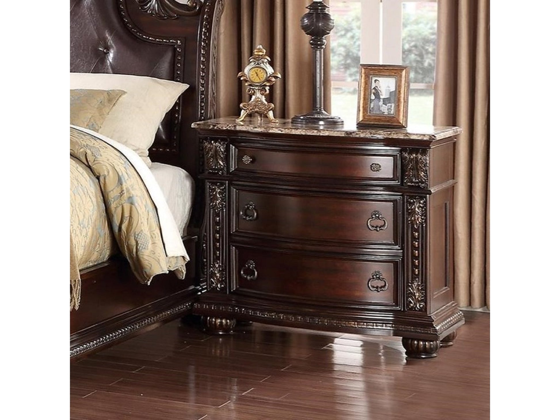 Dark mahogany nightstand with marble top and ornate carved details