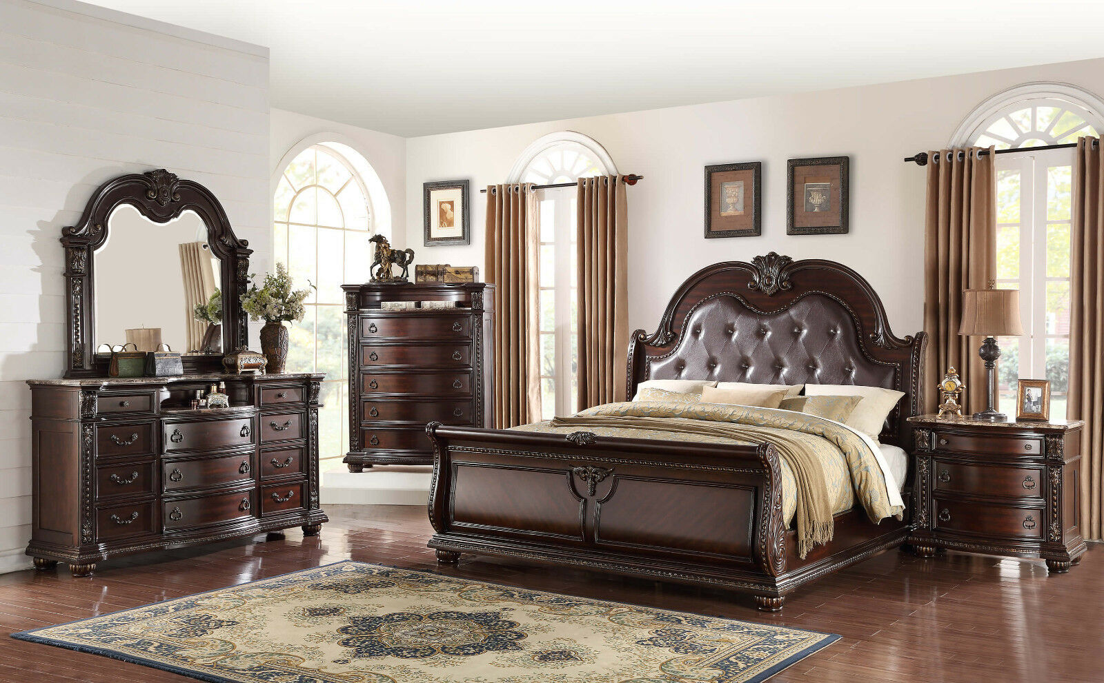 Ornate dark wood sleigh bed with tufted leather headboard