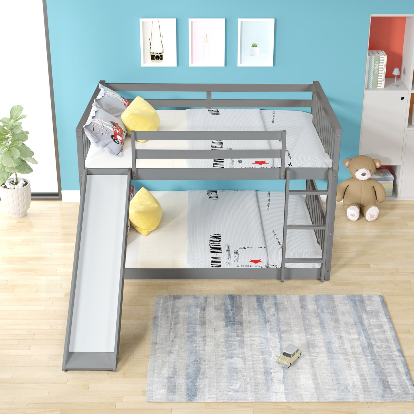 Gray wooden bunk bed with slide and bedding