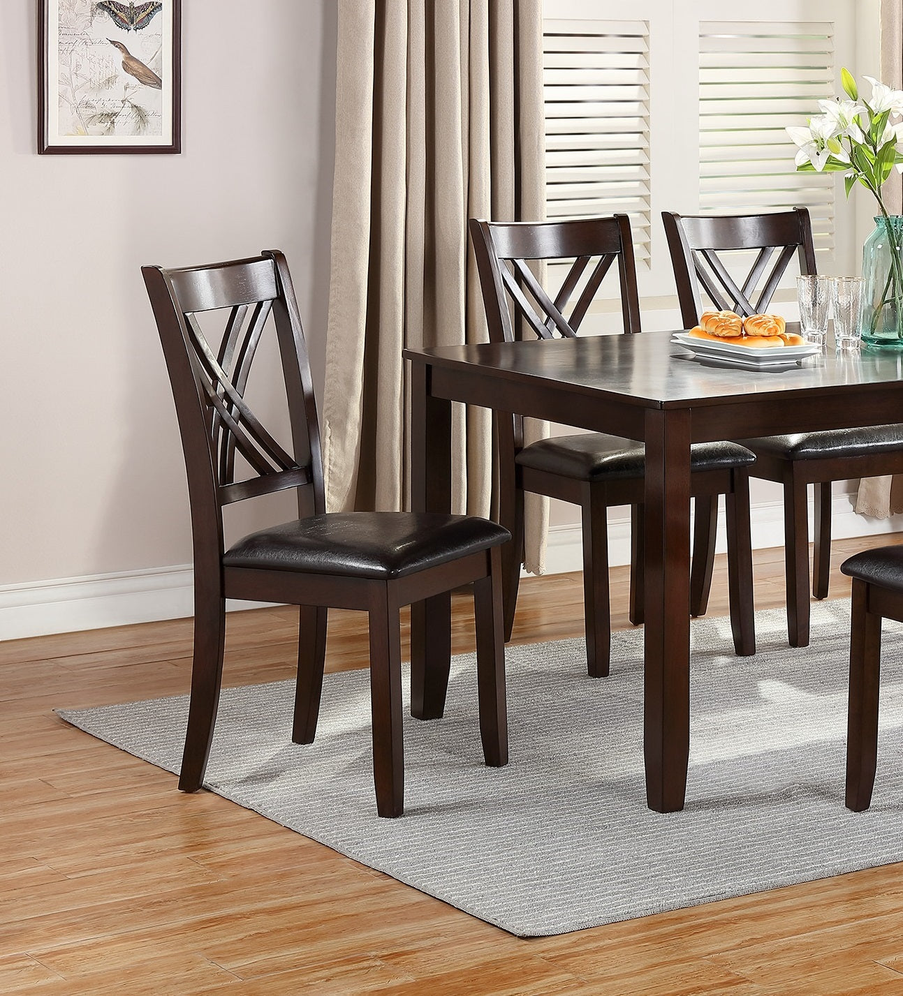 Dark brown wooden dining chair with black faux leather seat and Xback design