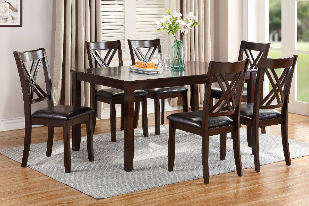 Dark wood dining table and chairs with faux leather seats