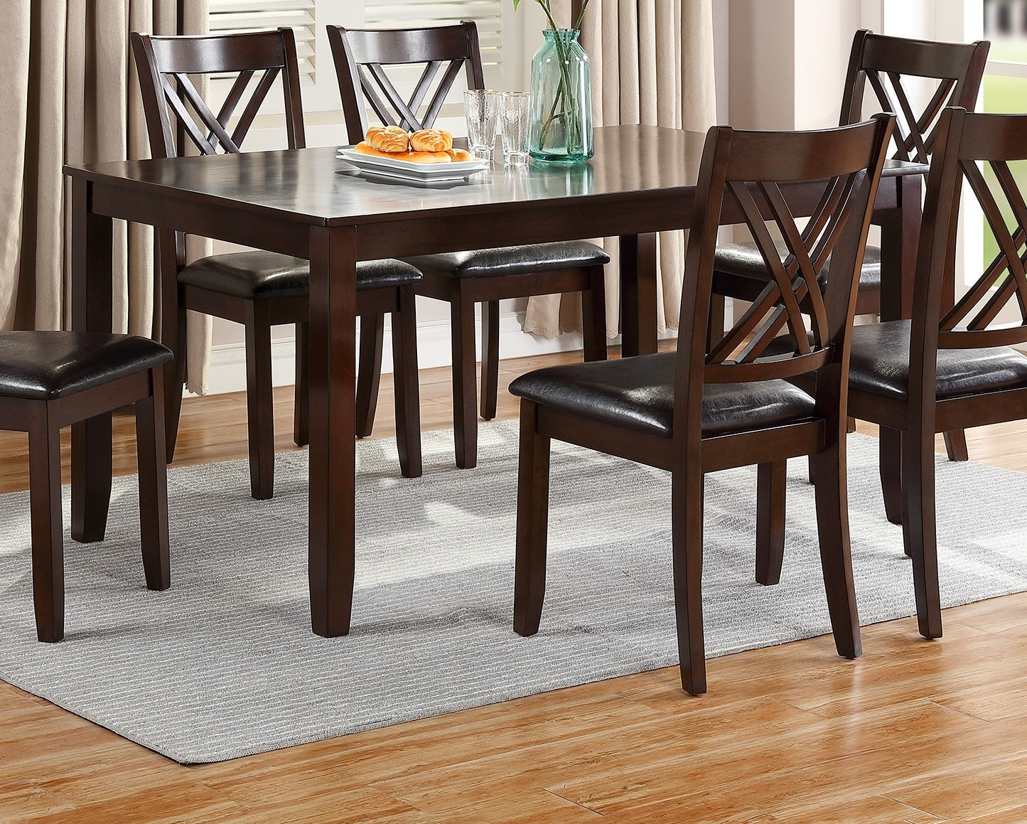 Dark wood dining table with espresso chairs