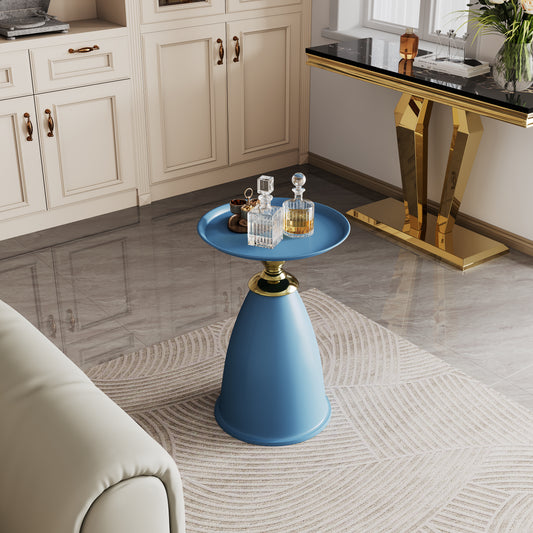 Blue conical accent table with gold base and decorative bottles