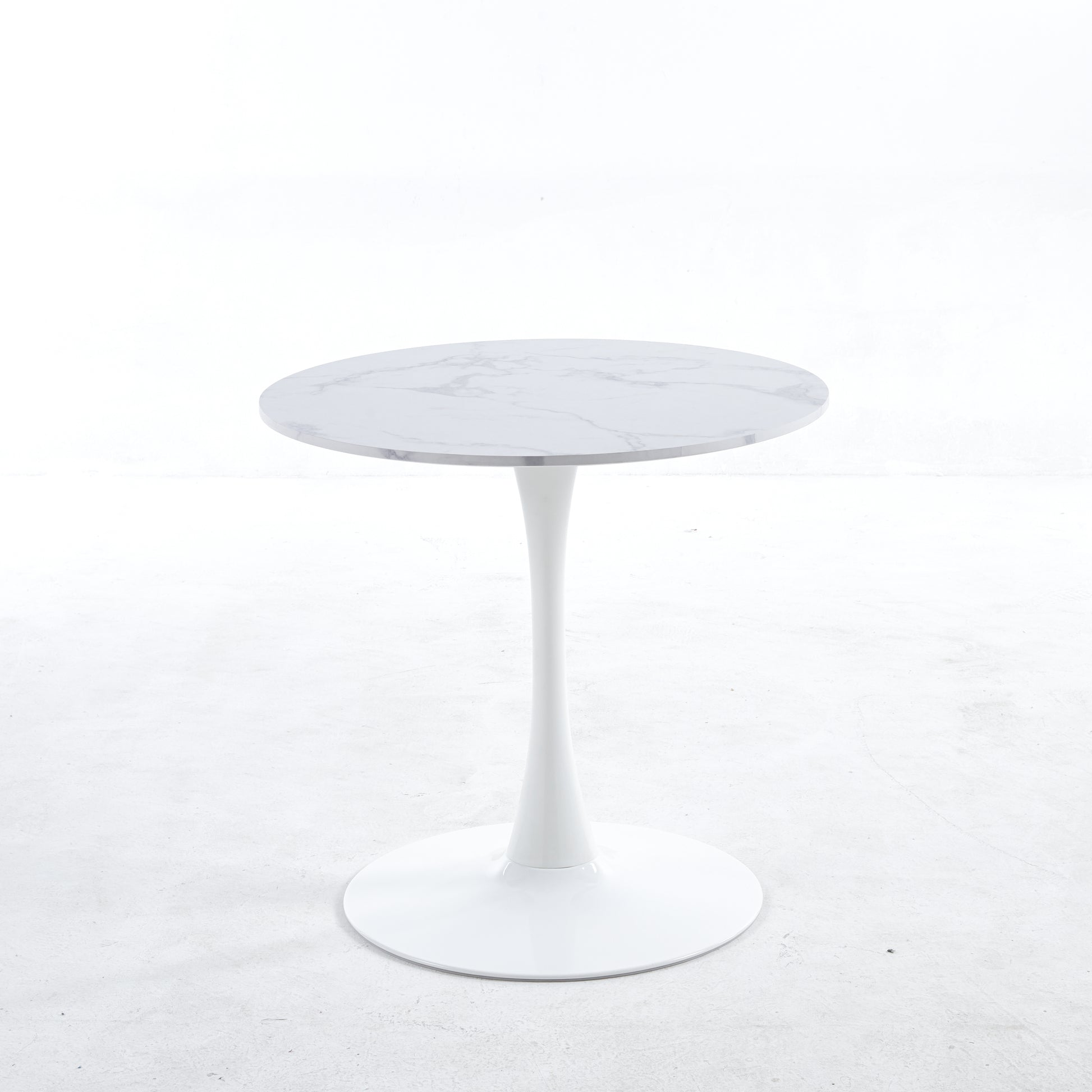White marble top tulip table with a sleek modern white pedestal base perfect for dining rooms
