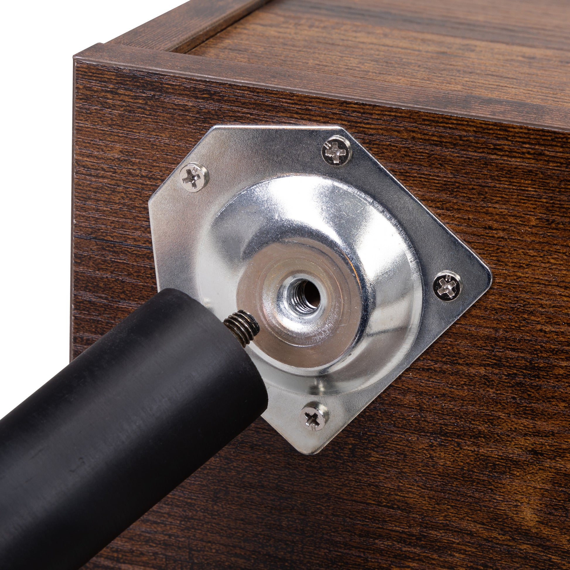 Dark wood dresser base with a detached black furniture leg and silver mounting plate